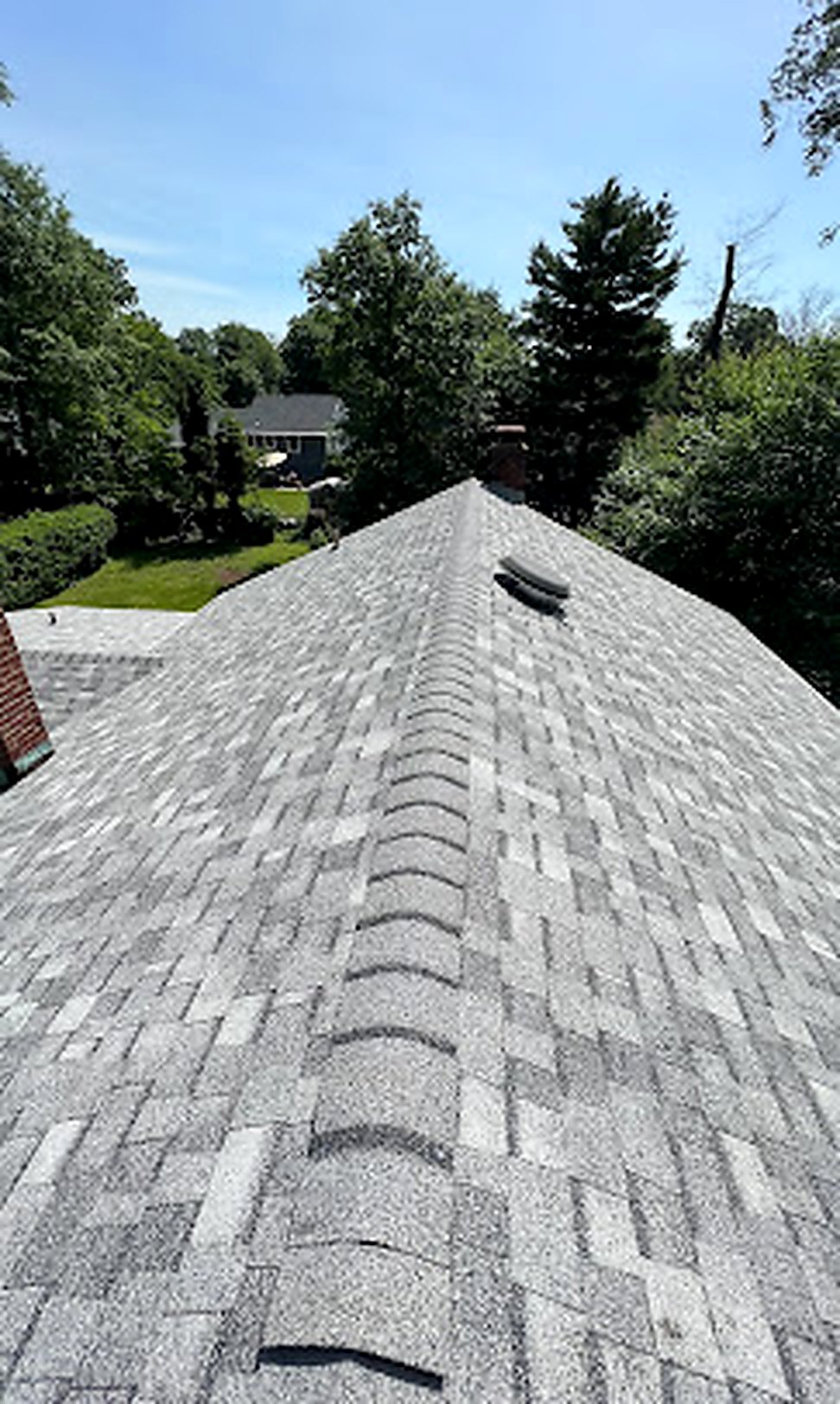 Finished gray shingle ridge cap detail